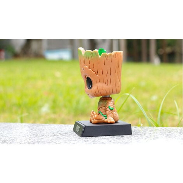 Groot-hahmon sarjakuva-autokojelaudan keinuva nukkehahmo Söpö anime Groot -auton lisävarusteet