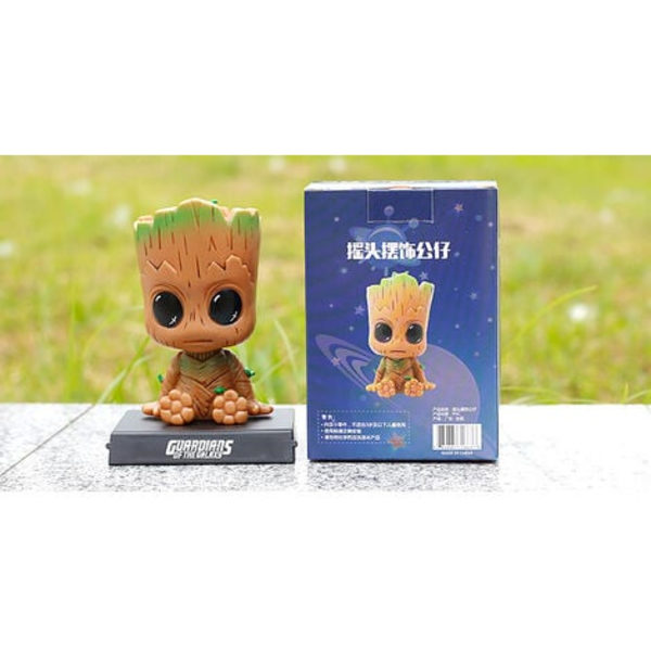 Groot-hahmon sarjakuva-autokojelaudan keinuva nukkehahmo Söpö anime Groot -auton lisävarusteet