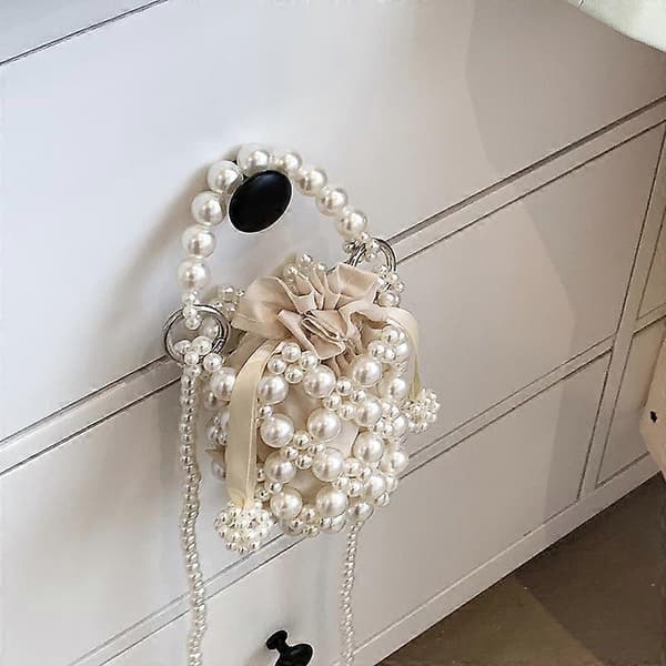 Pärlbudväska handstickad