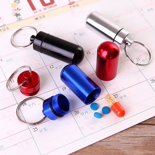 7 stk. bærbar mini pilleboks tanche i aluminiumlegering pilleflaske 7 farger i 7 dager pilleholder nøkkelring pillebeholder-PHWJ