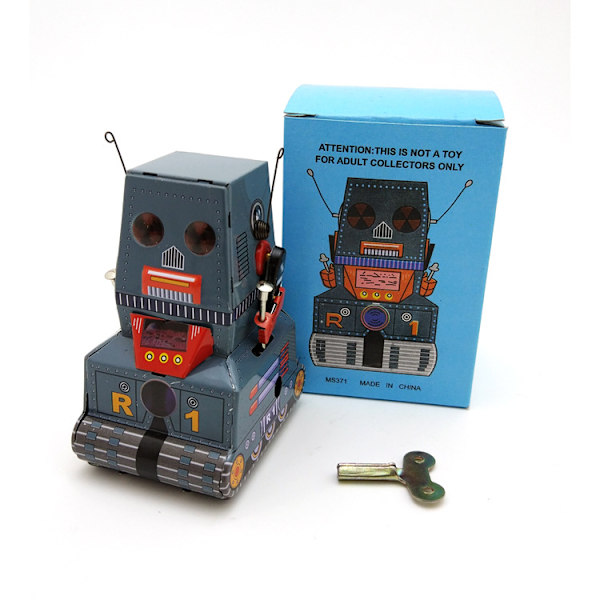 Vintage-tyyliinen kellokoneistoinen robottilelu peltilevystä, klassinen retro-koriste valokuvausrekvisiitaksi, kokoelmaksi, joulu- ja syntymäpäiväjuhliin