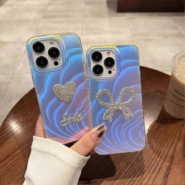 Deksel til iPhone 14 Pro Max Rhinestone Hjerte/Sløyfe IMD Akryl+TPU Telefondeksel