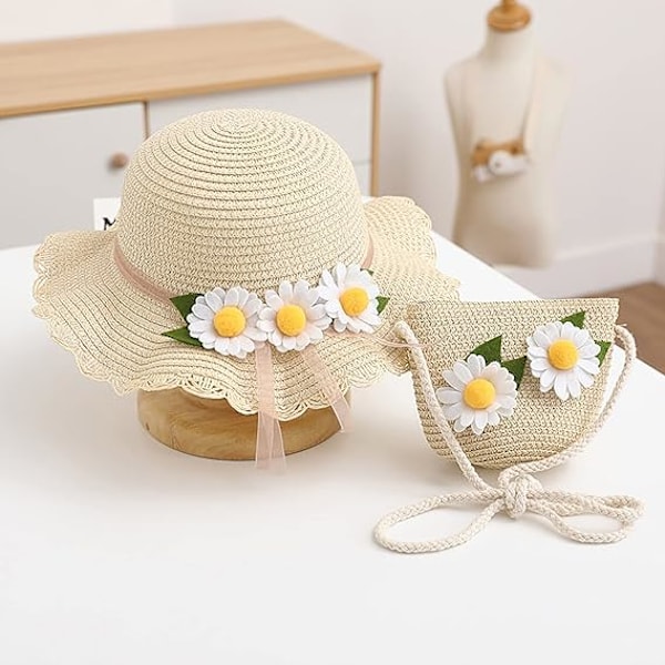 Sommerhatt med bred brem i strå for små jenter, med blomst og skulderveske