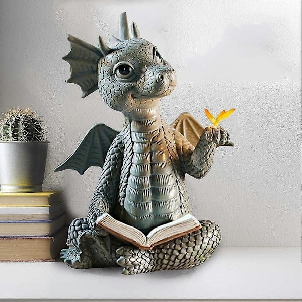Drakstaty Läser Bok Dinosaurie Håller Fjärilsfigurer A