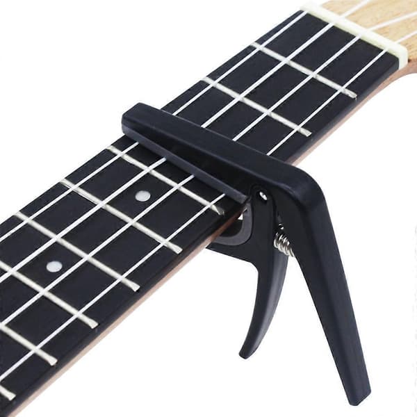 Professionell Ukulele Capo 4-strängad Gitarr Capos Enhands Snabbväxling