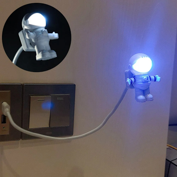 Bärbar USB-driven nattlampa i astronautform för läsning