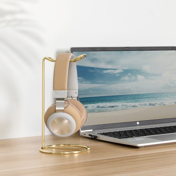 #Hodetelefonstativ i gullfarge med metallbase#