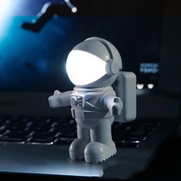 Bärbar USB-driven nattlampa i astronautform för läsning
