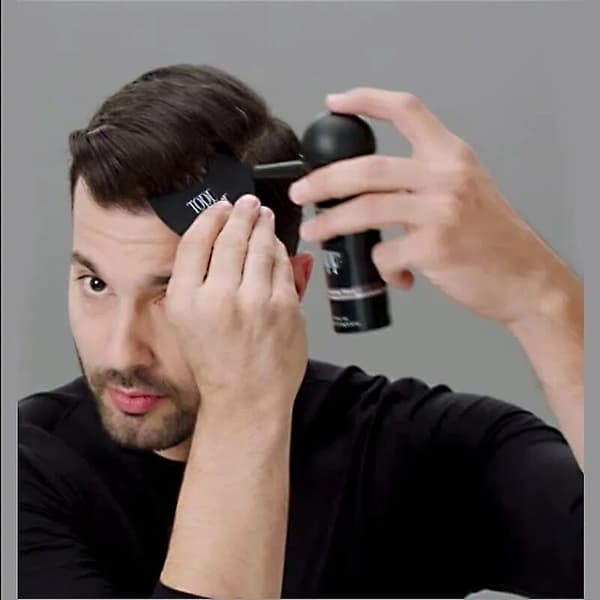 Förtjockande spray för svart hår baserad på keratinfibrer för att främja hårväxt.