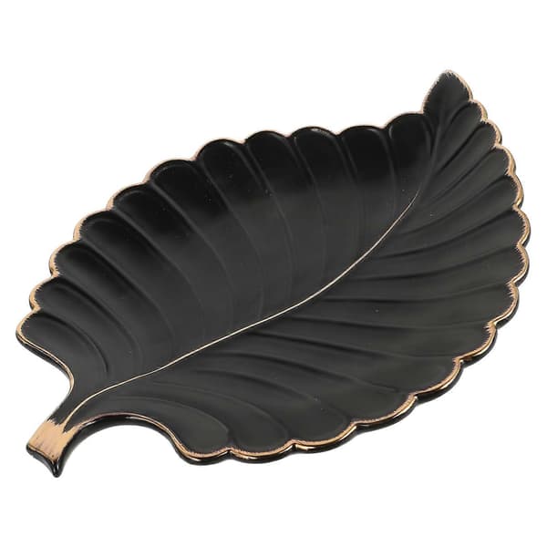 Elegant lövformad keramisk bricka med guldkant, lämplig för smycken och små prydnadssaker.