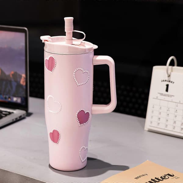 Stilig isolert vannflaske, 1200 ml, i rustfritt stål, rosa hjerte-mønster, et must for sport og reise.