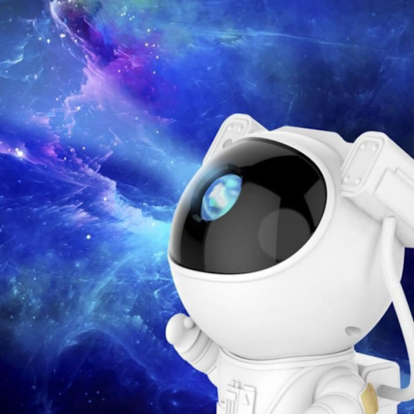 Astronautti luova tähtiprojektorilamppu, täynnä tähtiä, avaruusmiehen tunnelmalamppu