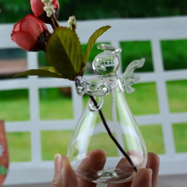 Ängelformad transparent glas väggmonterad vas, lämplig för att dekorera växter och blommor.