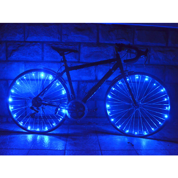 Blå pakke med 4 dæk LED cykelhjul lys med batterier inkluderet