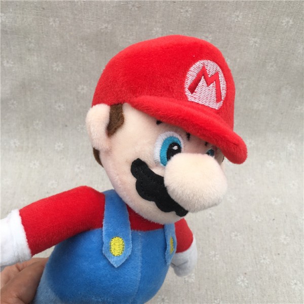 Et rødt 25 cm Super Mary plysjleketøy Mario Brothers dukke tegneseriespill