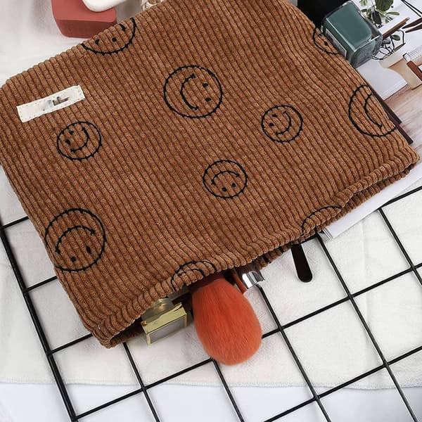 ##/1 sminkväska i sammet (brun smiley-design),##/
