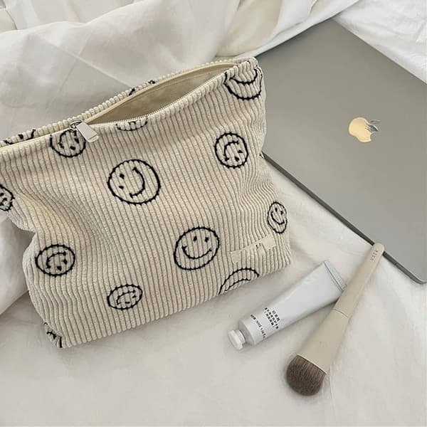 ##/1 sminkväska i sammet (beige smiley-mönster), tro##/