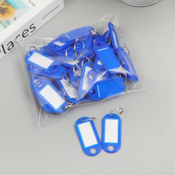 Blå pakke med 50 tag nøkkelringer, 4,7 x 2 cm plast tag nøkkelring med