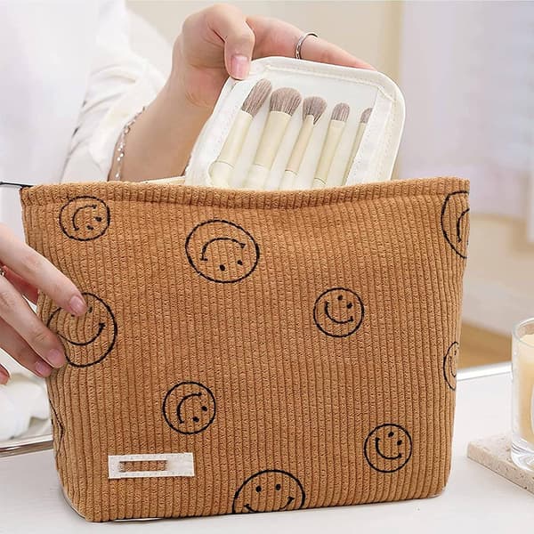 ##/1 sminkväska i sammet (brun smiley-design),##/