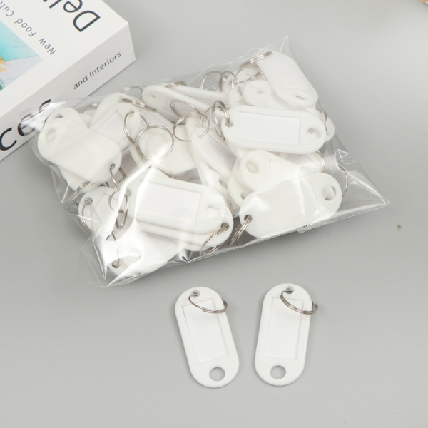 Blå pakke med 50 tag nøkkelringer, 4,7 x 2 cm plast tag nøkkelring med