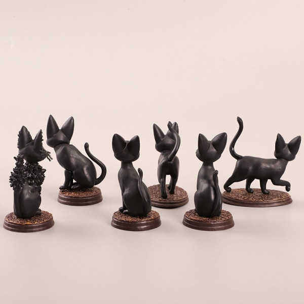 6 erilaista mustan kissan käsianimaatiosarjakuvanukkeleluja