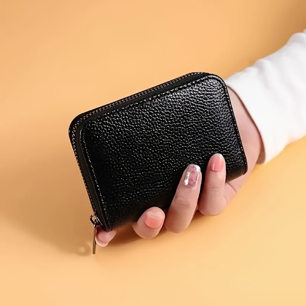 Herrplånbok i konstläder med elegant spänne och kortfack Svart