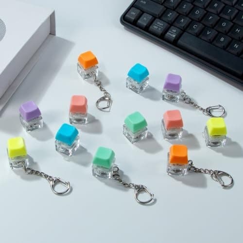 ILHSTY Tangentbordsfidgetleksak, 12-pack Lysande Klicker Nyckelring Macaron Orange