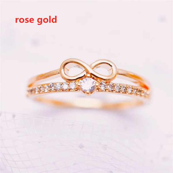 Guld Dainty Bow Ring sæt med runde udskårne uendelige elementer Zirconia