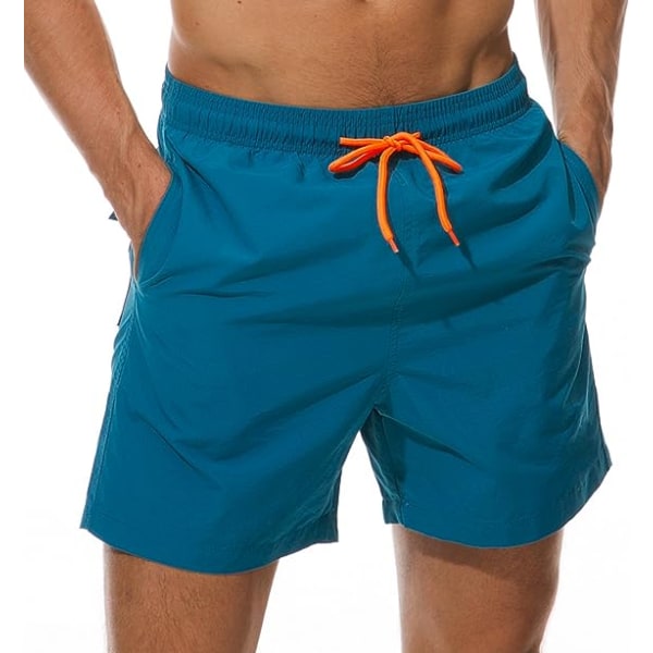 Miesten uimahousut Quick Dry -rantashortsit taskuilla, riikinkukonsininen