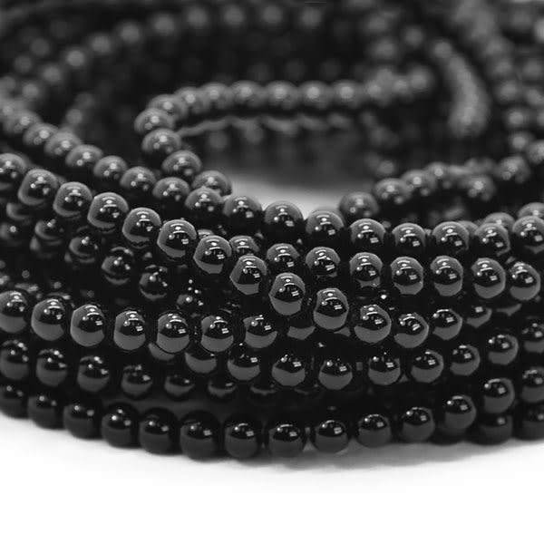 Små runda pärlor av naturlig tonad onyx, ca 3.4mm, ca 115st svart