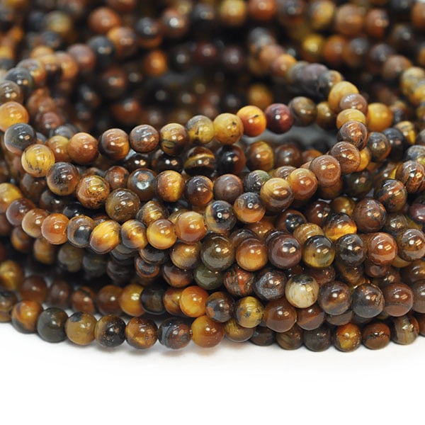 Små runda pärlor av naturligt tigeröga, ca 3-3.5mm, ca 120st brun