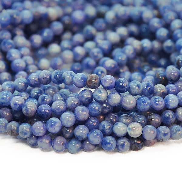 Små runda pärlor av naturlig, tonad sodalit, ca 3.3mm, ca 125st blå