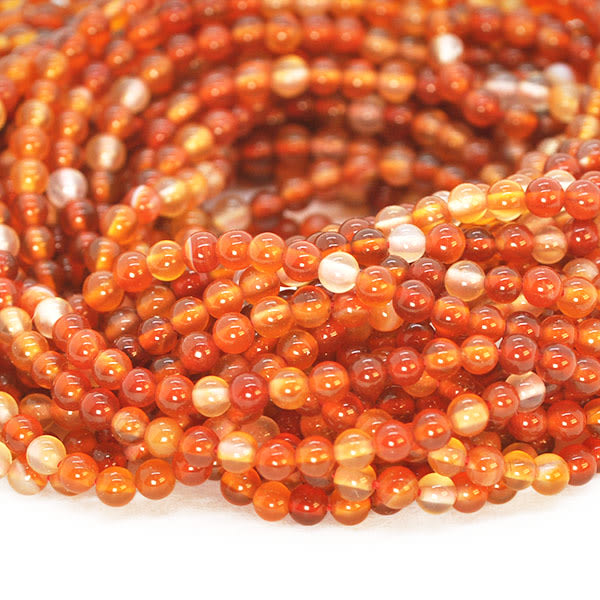 Små runda pärlor av naturlig, tonad karneol, ca 3mm, ca 130st orange