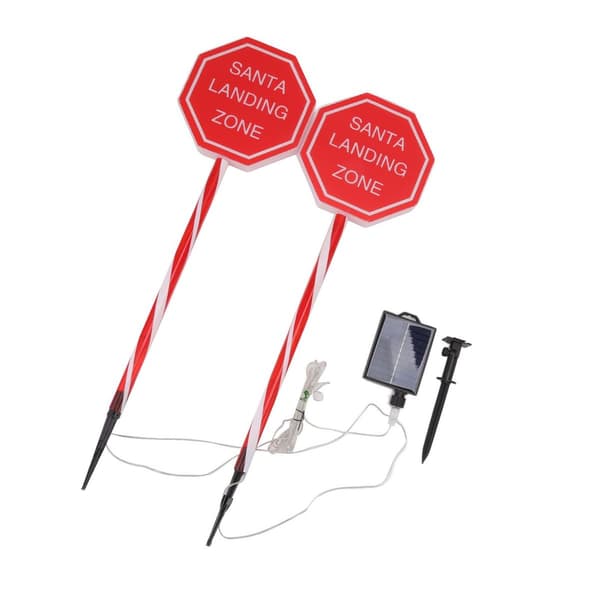 Vedenpitävä LED-aurinkolamppu \"Santa Stop Here\" -kyltillä. KLB