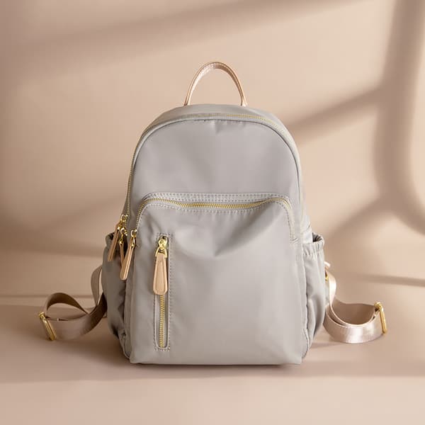 Light Grey Water-Resistant Nylon Backpack with Gold-Tone Zippers Faux Leather Top Handle Multiple Zippered Compartments and Side Pockets