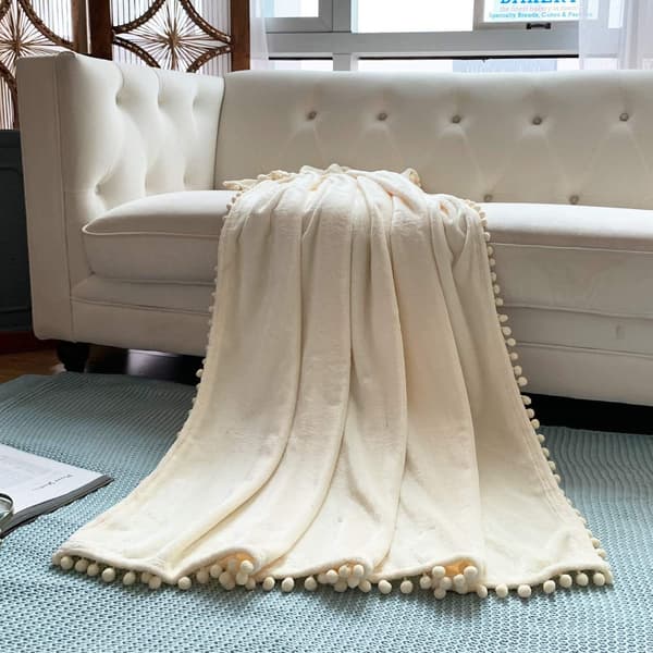 Flanellipeitto pompom-nappipeitolla, kodikas sängynpeitto Sohva