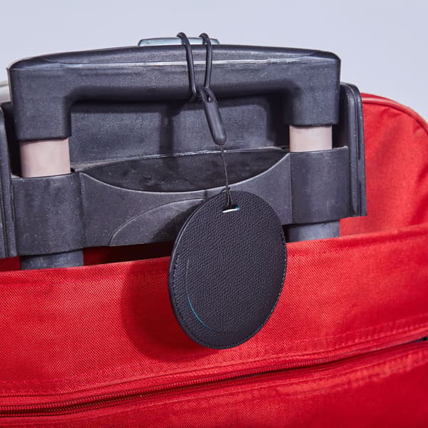 Runde bagasjelapper i skinn, 7 stk PVC-bagasjelapper
