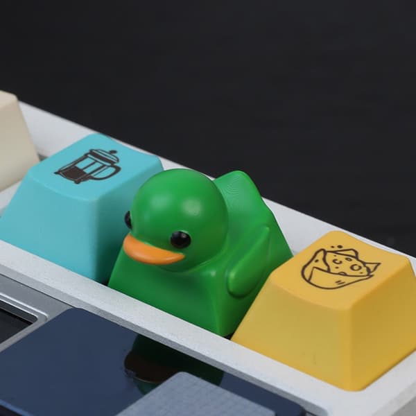 Yndig Andeformet Skrivebordslegetøj Nøglering Elastisk Resin Keycap Til Angstreduktion Yellow