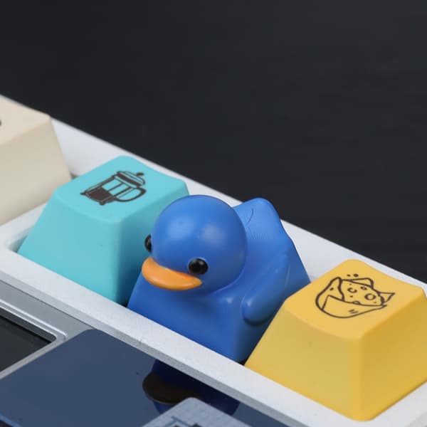 Yndig Andeformet Skrivebordslegetøj Nøglering Elastisk Resin Keycap Til Angstreduktion Yellow
