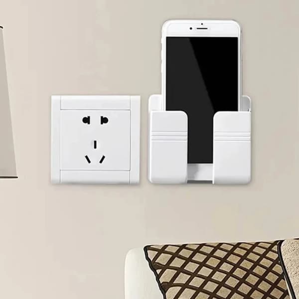 Väggmonterad telefonhållare, ingen borrning krävs, vertikal design, med fjärrkontrollförvaring och laddningsfunktion.