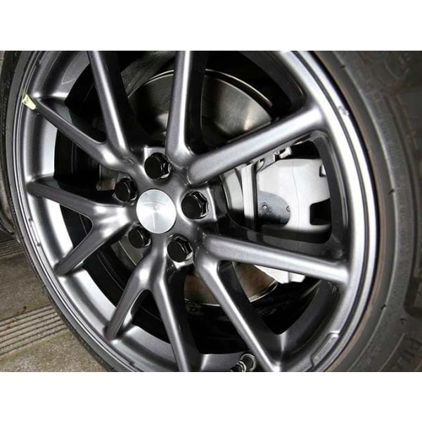 4-pakk - Tesla Keskihatut / Vannekeskusmerkit Silver