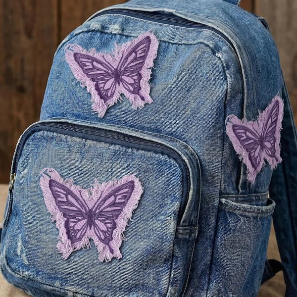 6 stk. denim sommerfugl-strykelapper, lilla brodert applikasjon