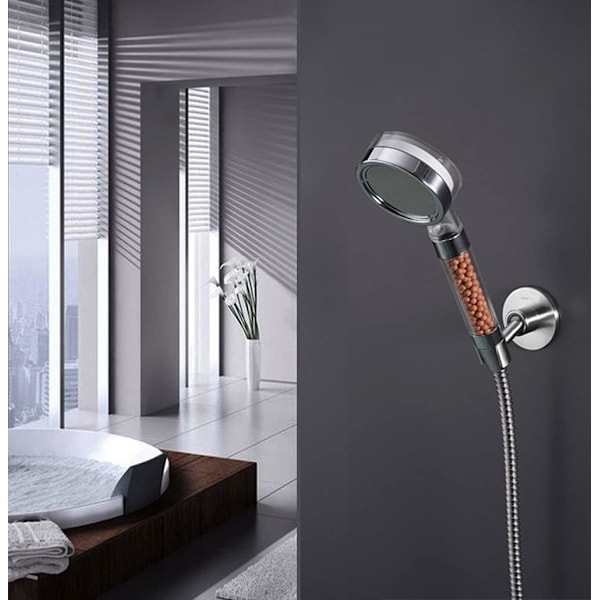 A silver perforated shower bracket with fixed base shower head universal adjustable shower accessories shower head hanger