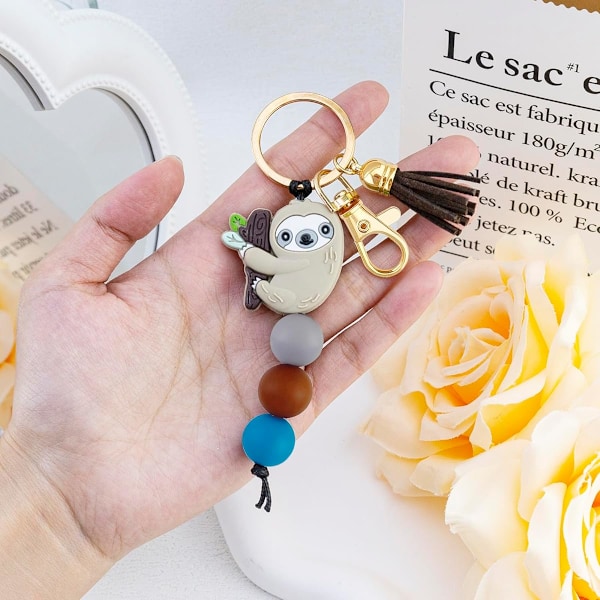 Dovendyrgaver til kvinner jenter dovendyr nøkkelring ornament ting dovendyr tema dekor silikonperlesmykker med dusk veske charms for dovendyr elsker – Håndveske,