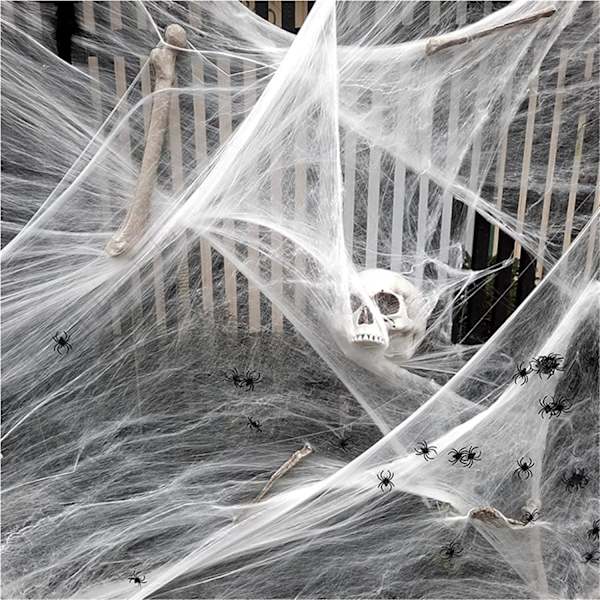 Halloween spindelvævsdekorationer med uhyggeligt stof og edderkopper