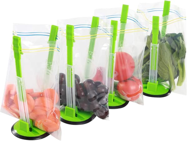Taskeopbevaringssystem – inkluderer to plastikposeholdere, plastikposeunderstøttelse og en håndfri madopbevaringsposeholder.