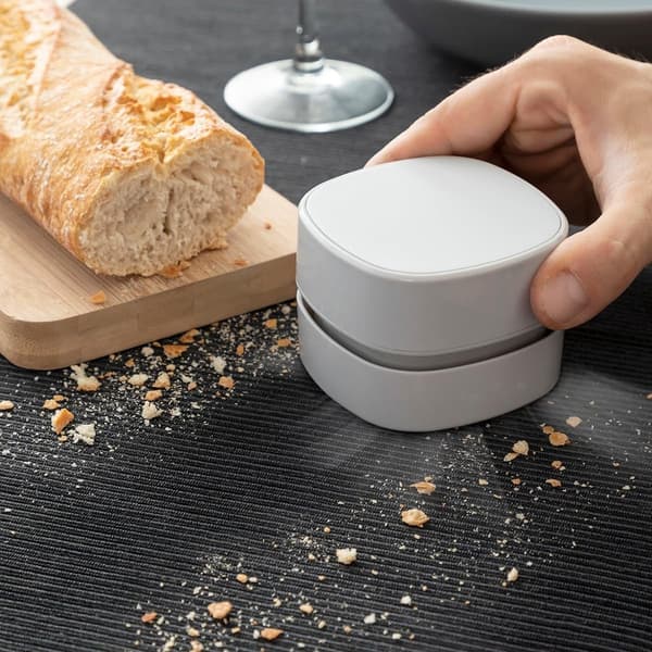 This mini desktop vacuum cleaner can quickly and easily clean small areas. Its compact and lightweight design makes it ideal for use. (White)