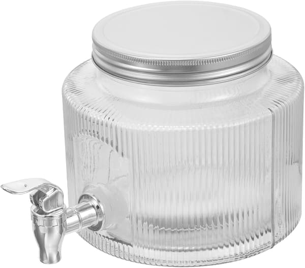Vanndispenser i glass med tappekran for fruktte og drikkedispensering under uformell underholdning