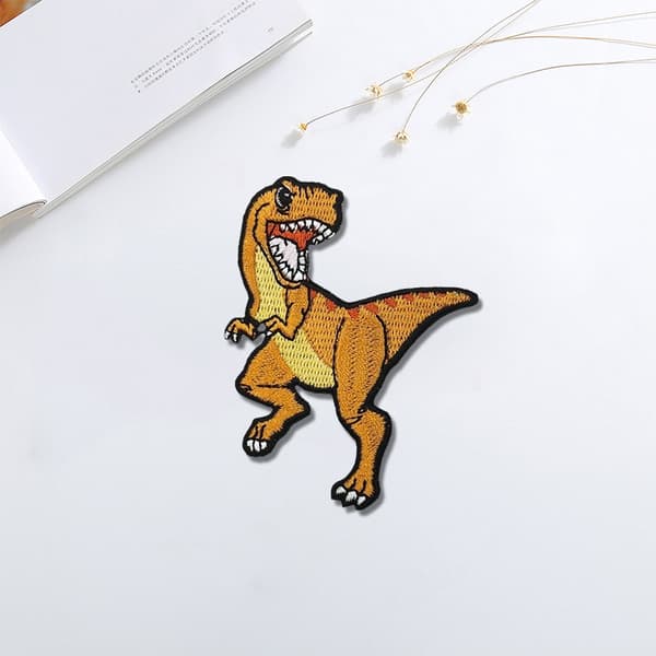15-pak dinosaur-formede lapper til tøjdekoration