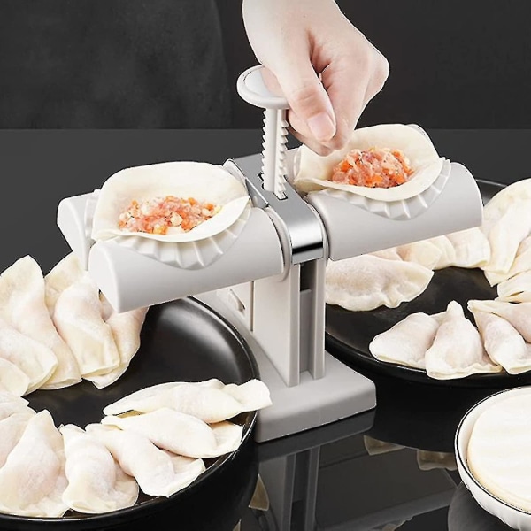 Dobbelt-hovedet automatisk dumplingsmaskine Husholdnings-dobbelt hoved rustfrit stål Manuel dumpling-støbeform Lav dumplings Empanadas hurtigt--